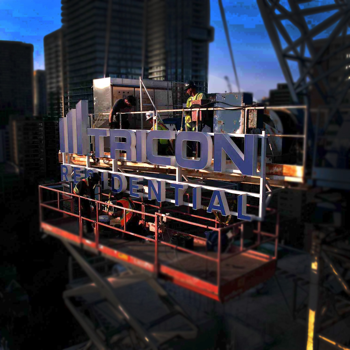 Installation of Illuminated Crane Sign for Tricon Residential